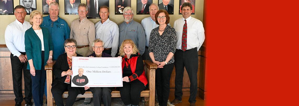Donor Foundation Board stand and pose with $1 million dollar check